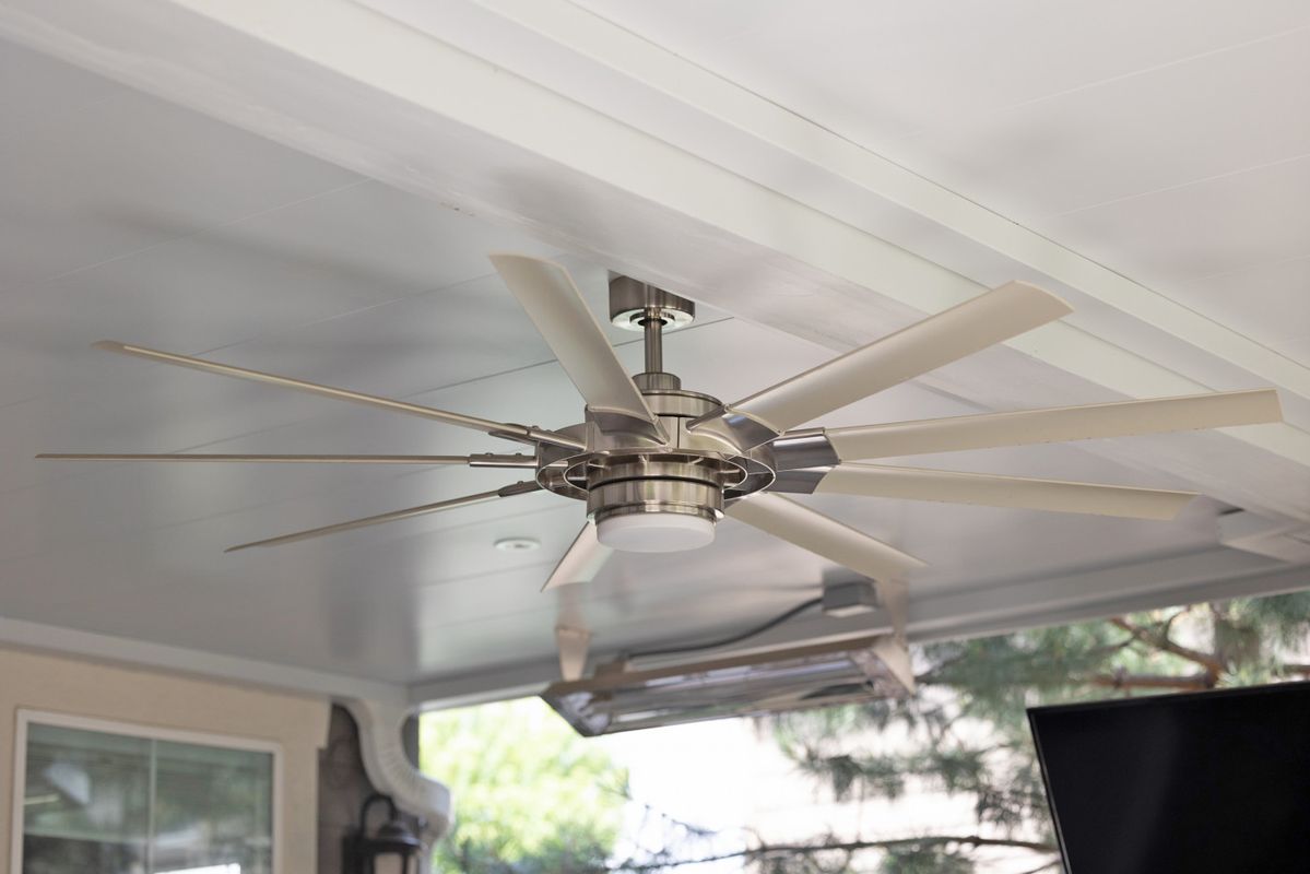Large ceiling fan integrated into an Undercover Systems underdeck ceiling